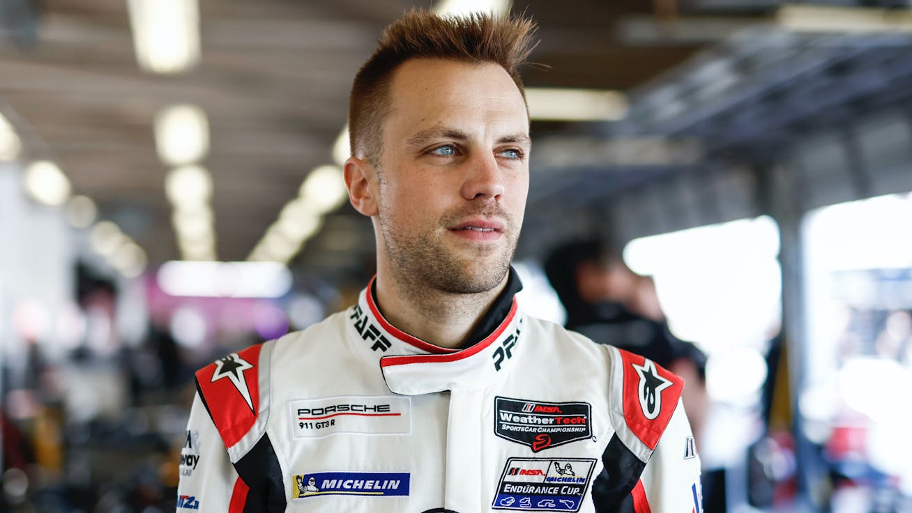 Laurens Vanthoor, in racesuit, looks into the distance