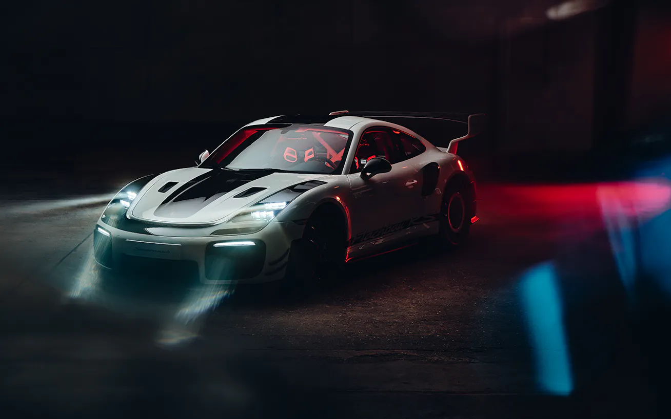 Porsche 911 Flachbau RS headlights on in dark studio