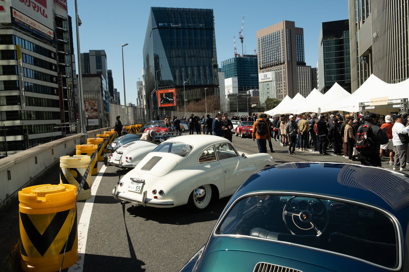 Porsche 356 coupe displayed at Luftgekühlt Tokyo with visitors gathered on the KK Line Expressway