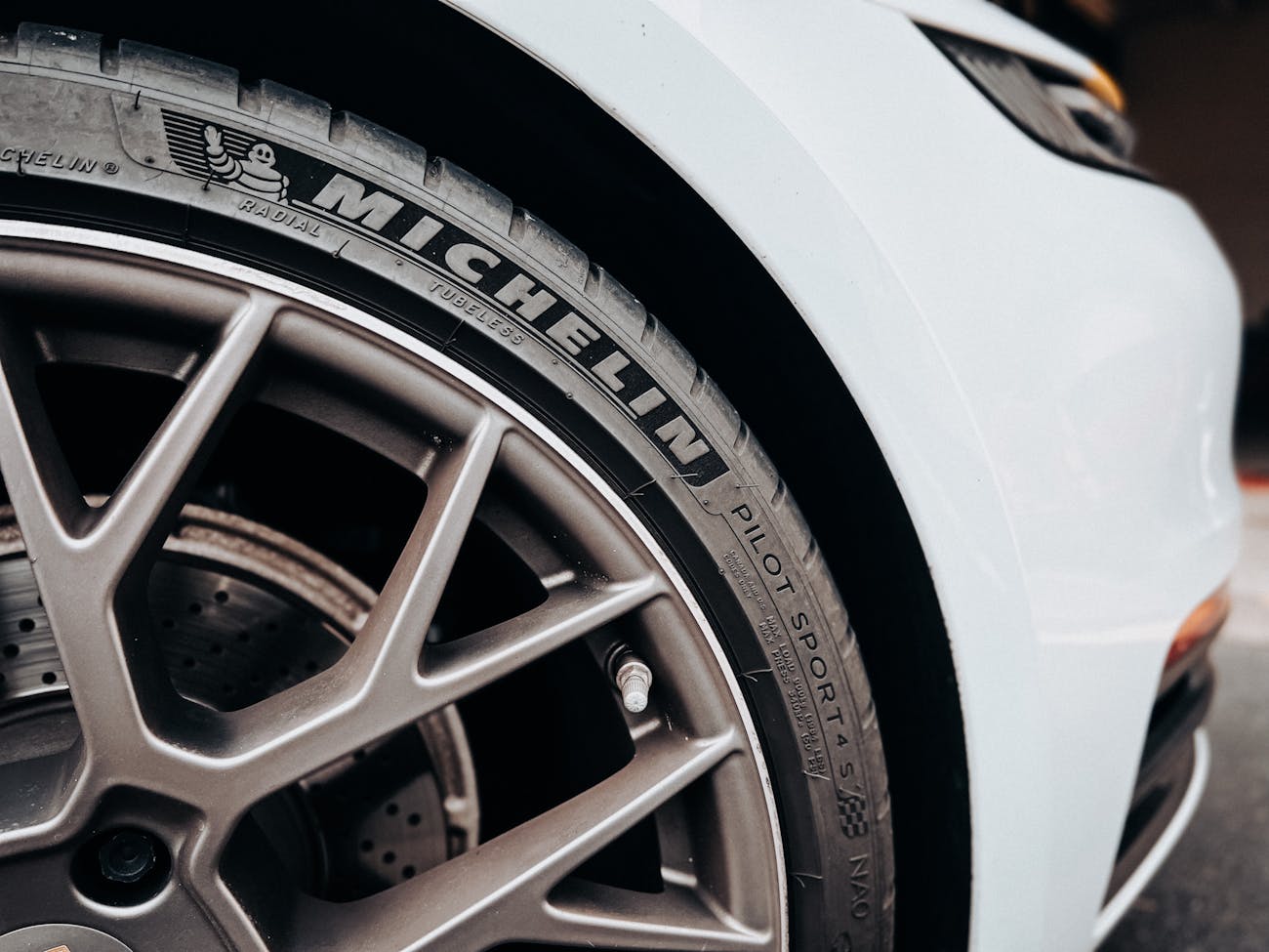 A close-up of a Michelin tyre on a Porsche