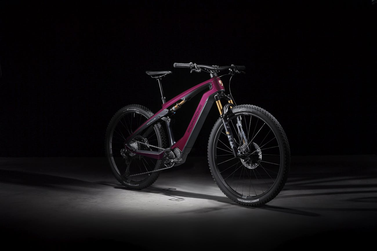 A Porsche eBike Cross Performance EXC model in the colour Star Ruby Neo