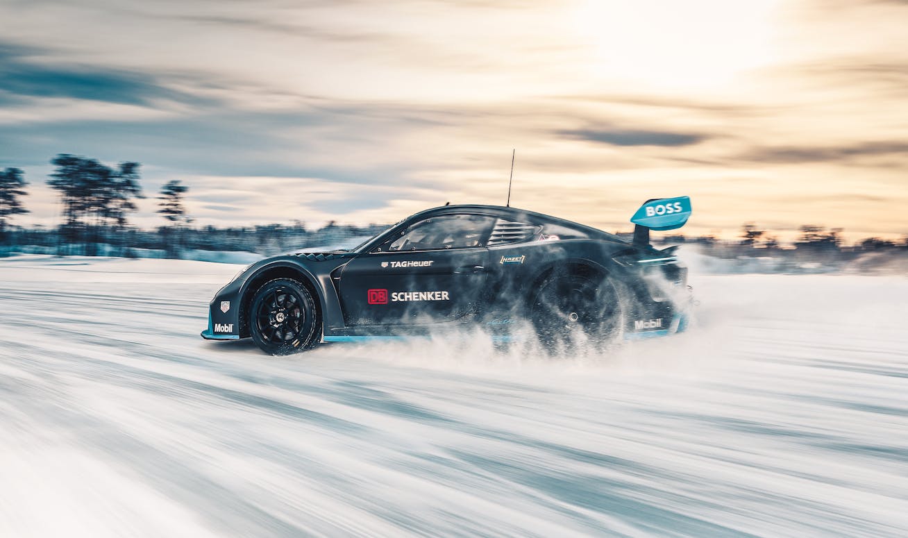 Porsche GT4 e-Performance drifting on a snow-covered racetrack