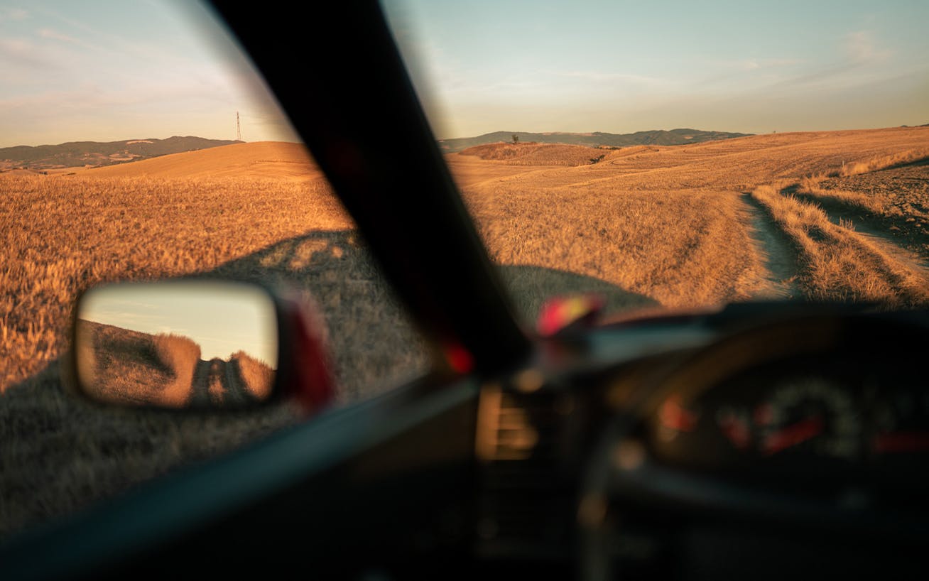 Sunset road view from inside a car 