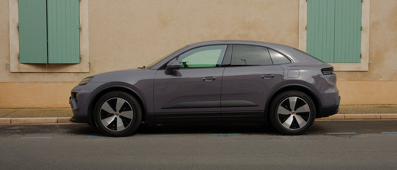 Porsche Macan 4 Electric against backdrop of shuttered Provençal building