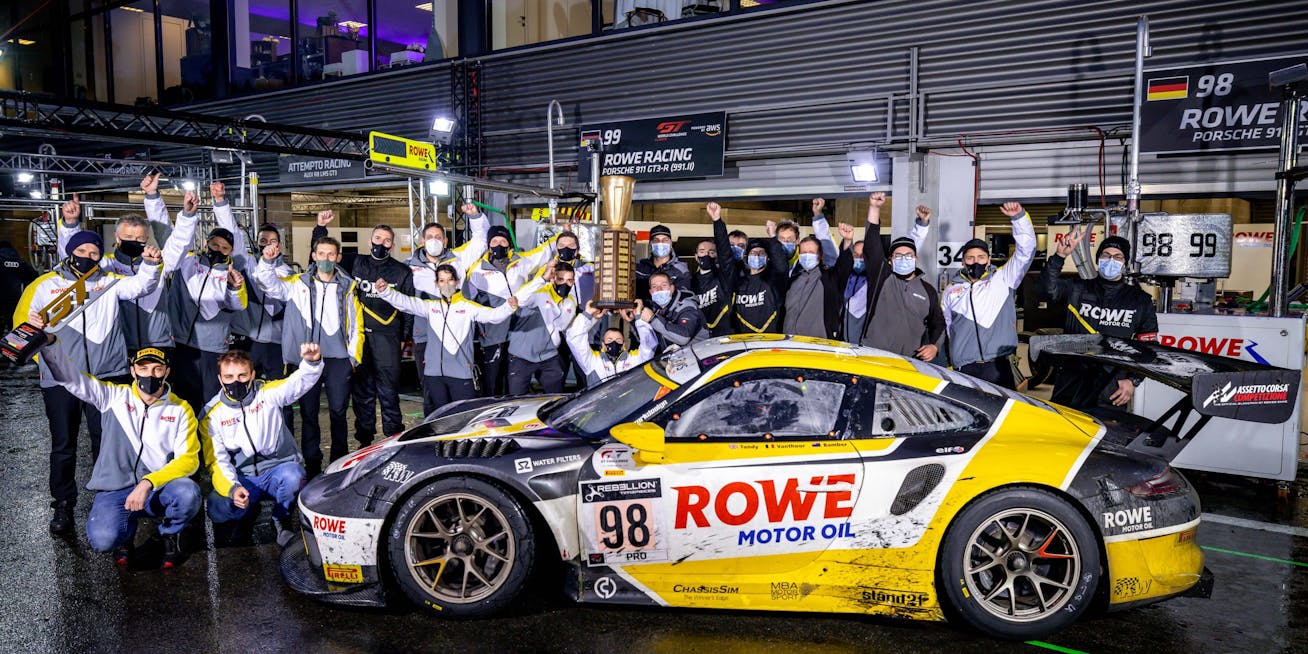 Group photo of ROWE Racing Team with Porsche 911 GT3 R