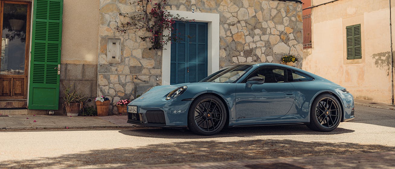 Porsche 911 Carrera parked in Mallorcan village desktop