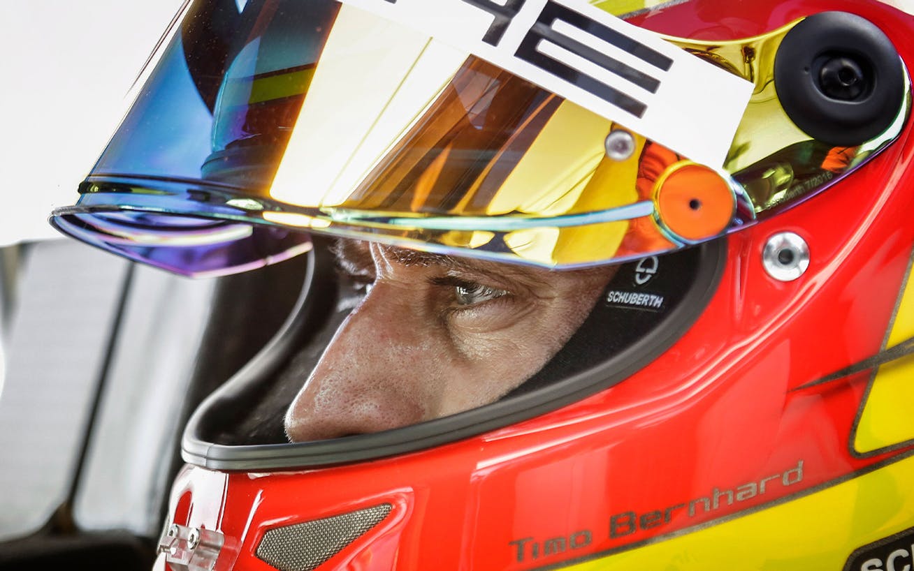 Close-up of Porsche driver Timo Bernhard in helmet at Nürburgring