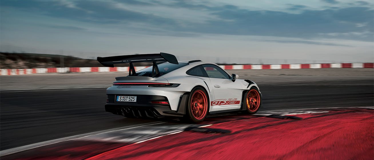 White Porsche 911 GT3 RS on racetrack 