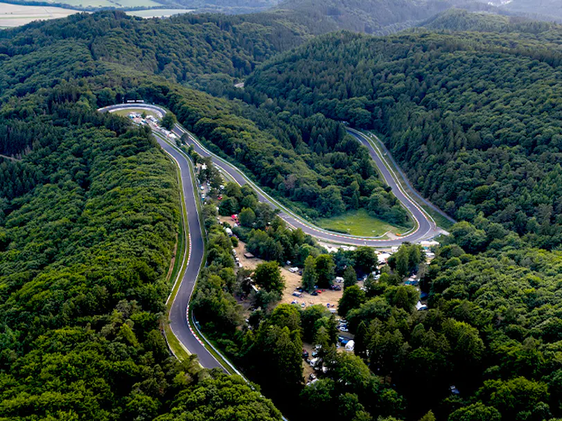Aerial view of the Nürburgring:Nordschleife circuit showing the Karussell hairpin_hero thumbnail