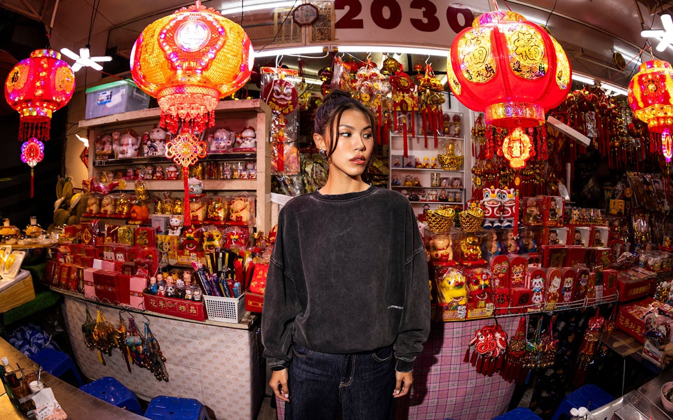 Close up of woman standing in souvenir shop  