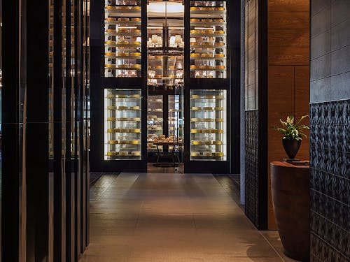 Numerous cheeses are stored in a metre-high, glass humidor