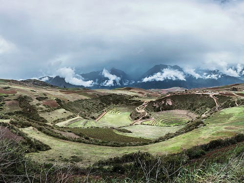 Inca ruins in Moray, Andean peaks in the background 