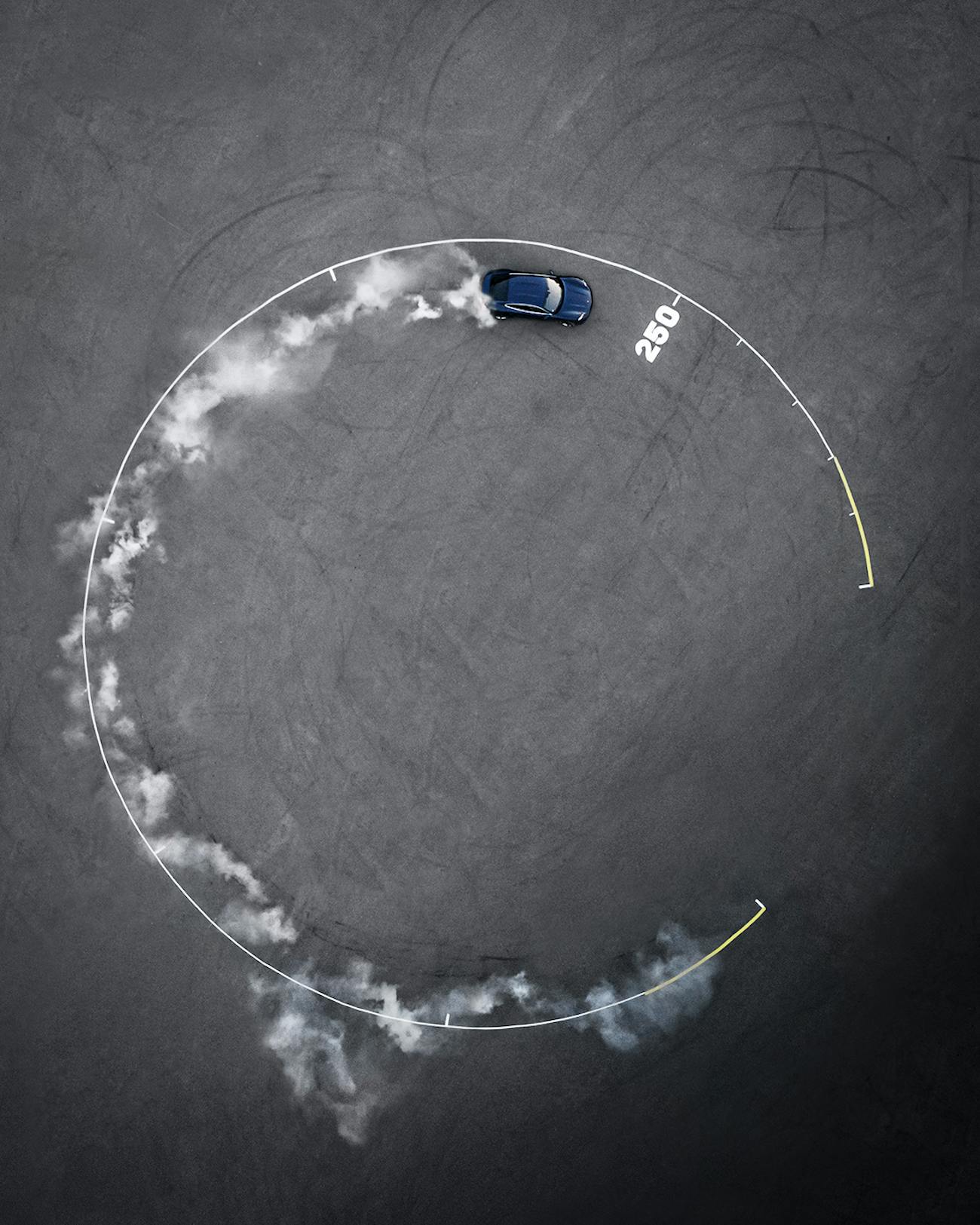 Porsche Taycan drives in circle with smoke billowing from rear