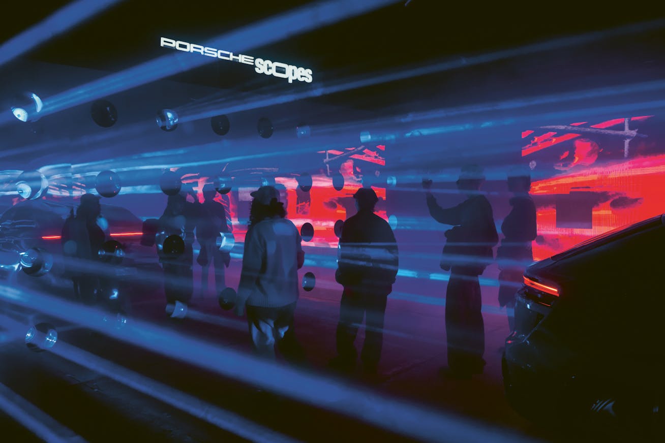 Art car installation featuring the Porsche Macan Electric by PRSMC