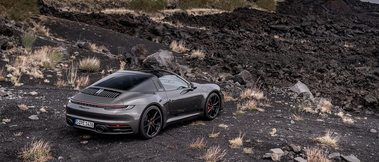 Porsche 911 Targa 4S (type 992.1) parked overlooking volcanic landscape on Porsche Travel Experience Sicily