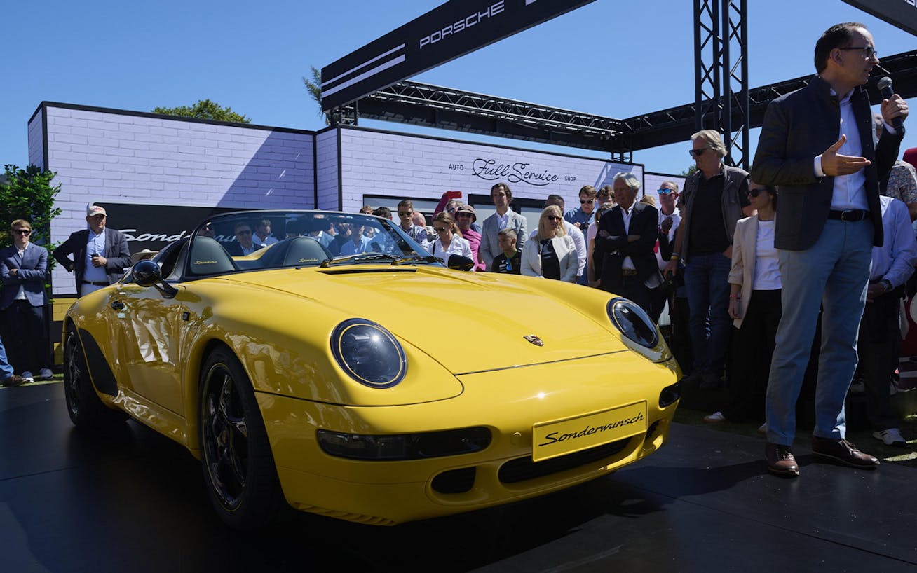 Yellow Porsche 911 Speedster (type 993) on podium at Monterey 