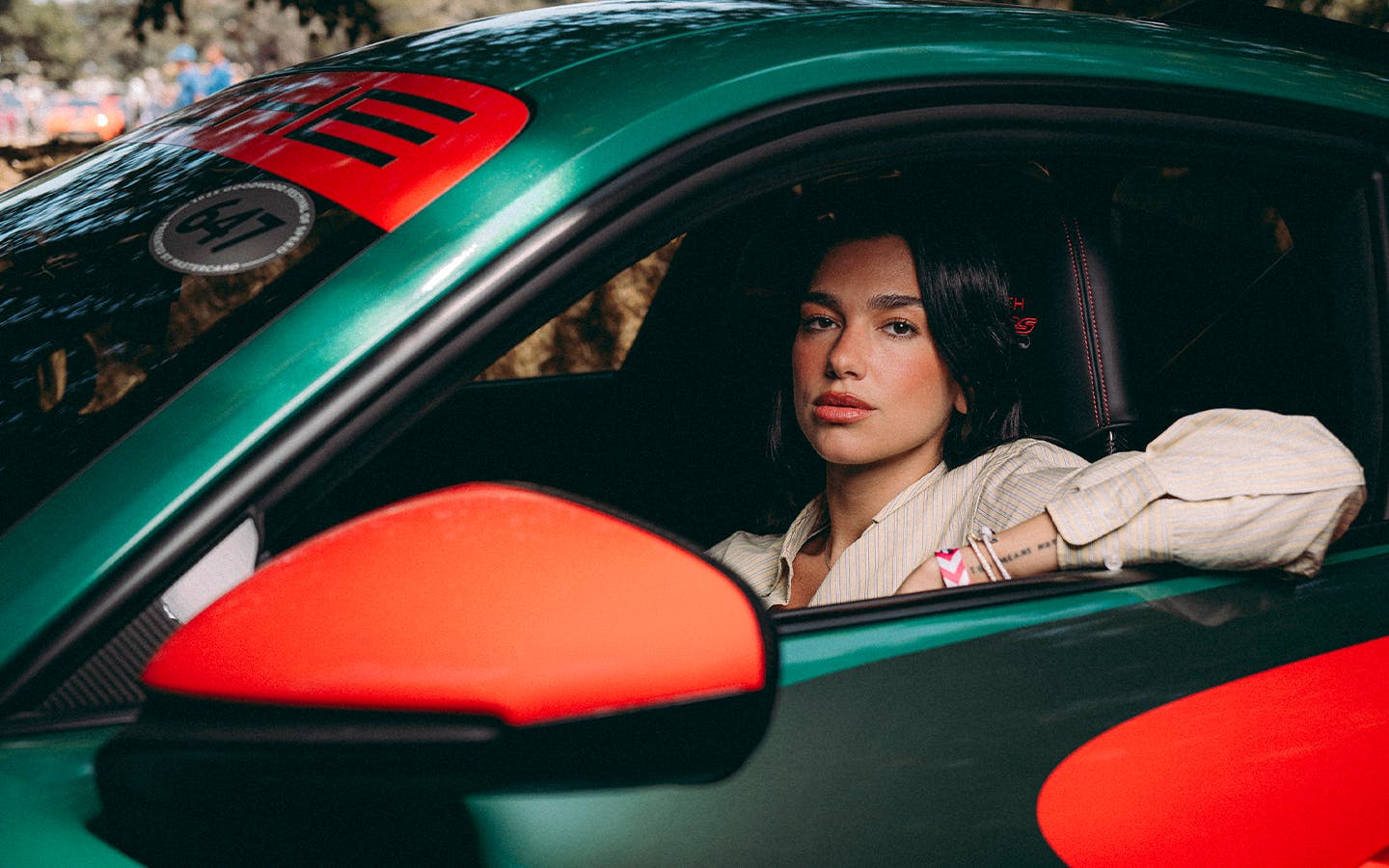 Dua Lipa sat in Dua Lipa Rennstall Porsche 911 GT3 RS at Goodwood Festival of Speed