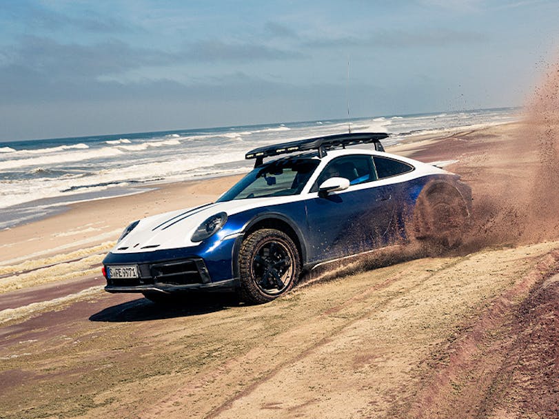Porsche 911 Dakar driving on Swakopmund beach in Namibia
