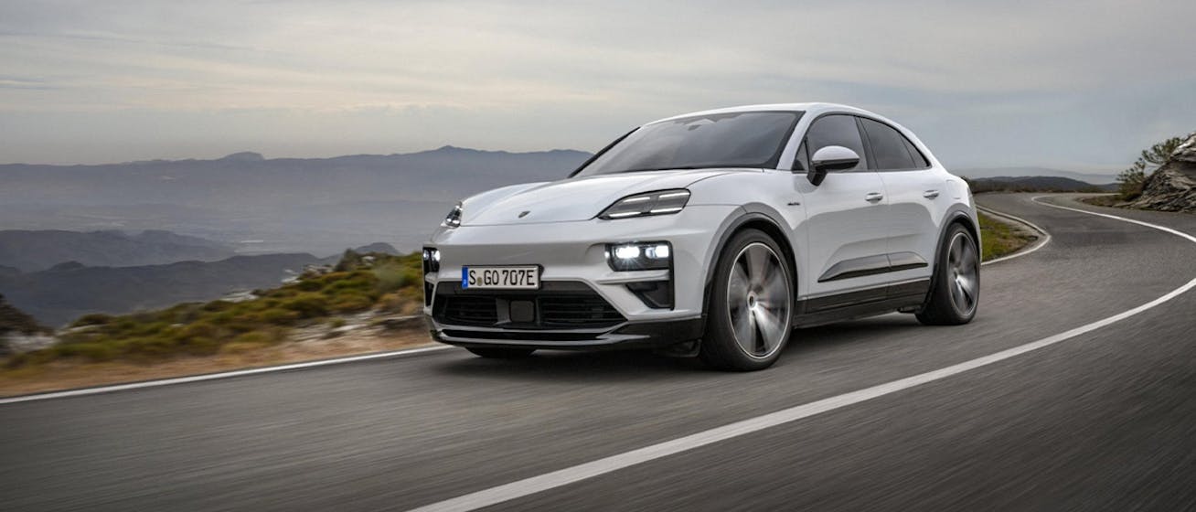 Porsche Macan Turbo Electric cornering on mountain road