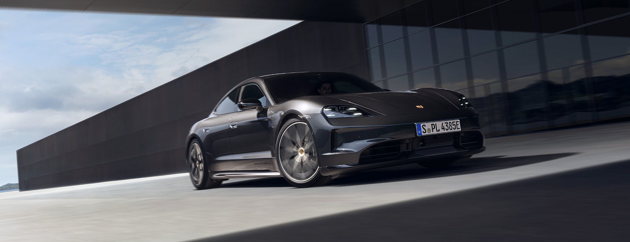 Porsche Taycan 4S Black Edition parked outside modern building
