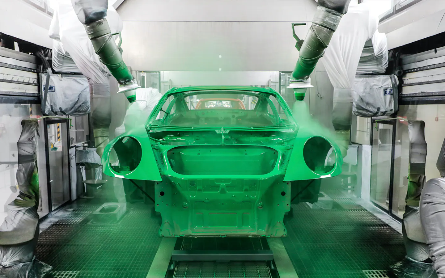Body of Porsche 911 being sprayed in Paint To Sample colour