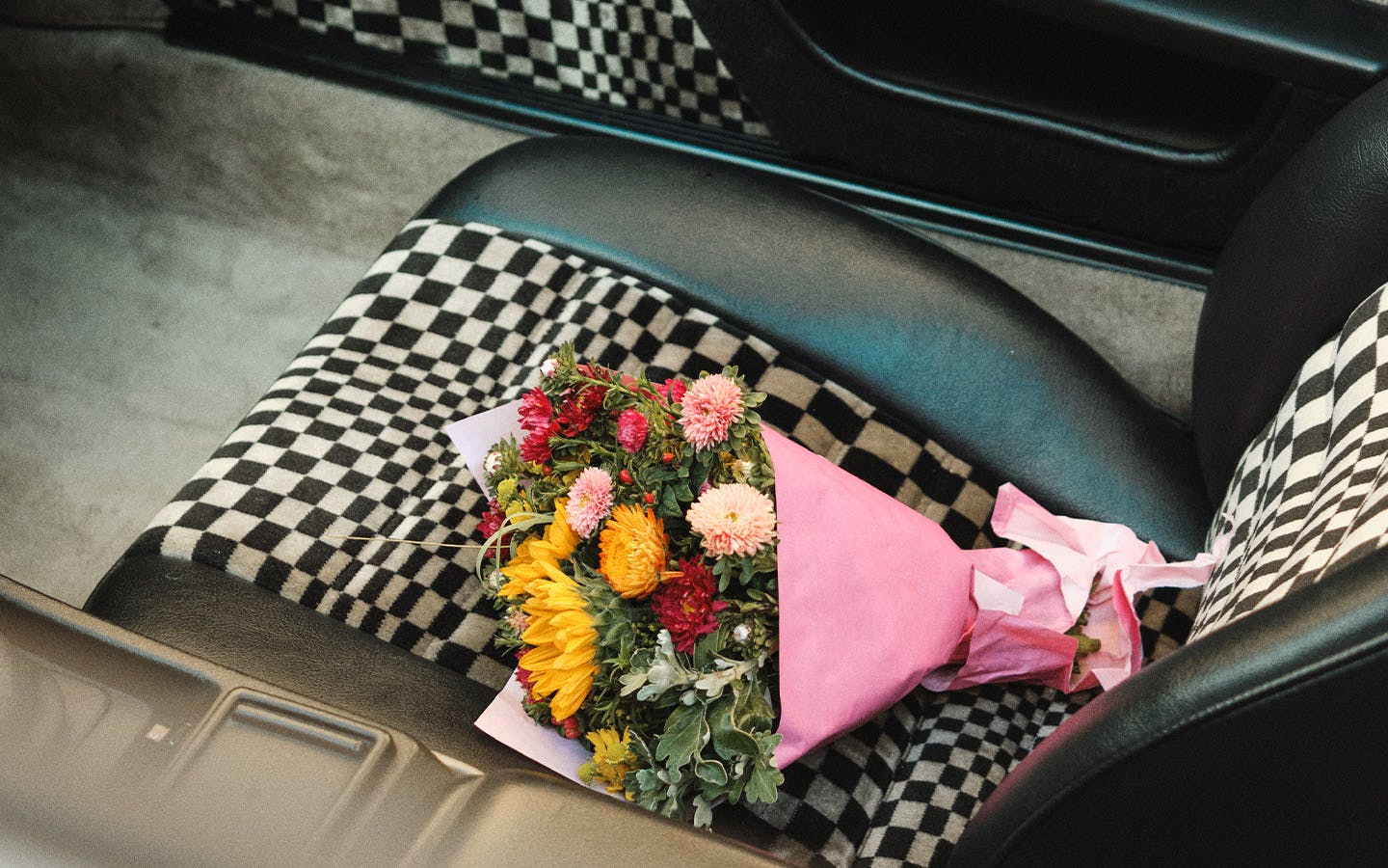 Bouquet of flowers on seat covered with Porsche Pasha fabric